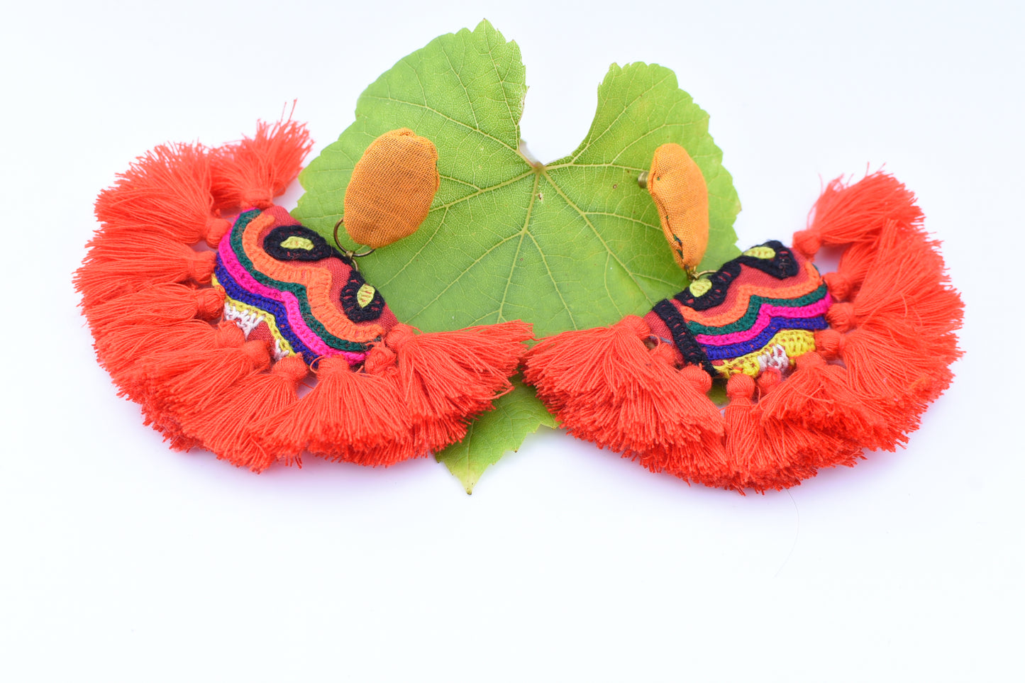 Orange festive earrings with tassels