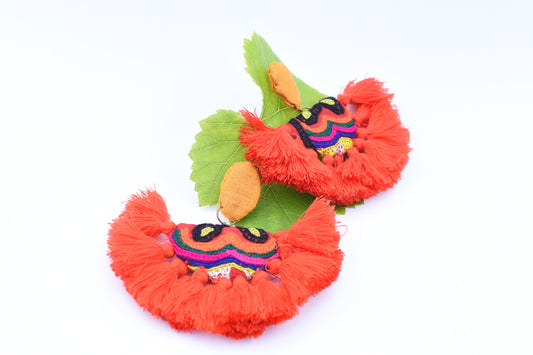 Orange festive earrings with tassels